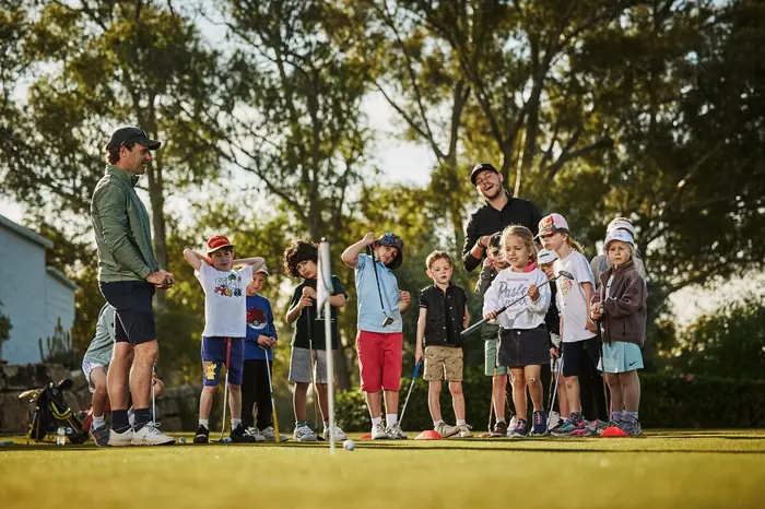 Junior golfers at a PG Golf and Sports Academy coaching session